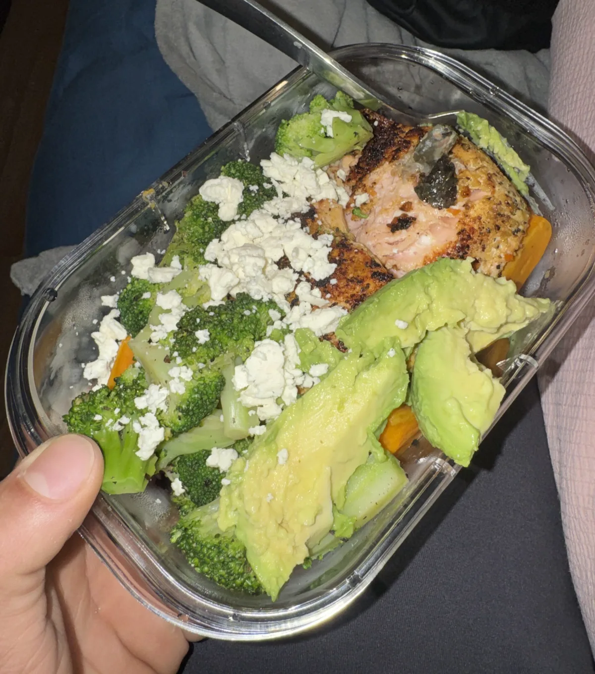 Glass meal prep container with chicken, broccoli, feta and avocado